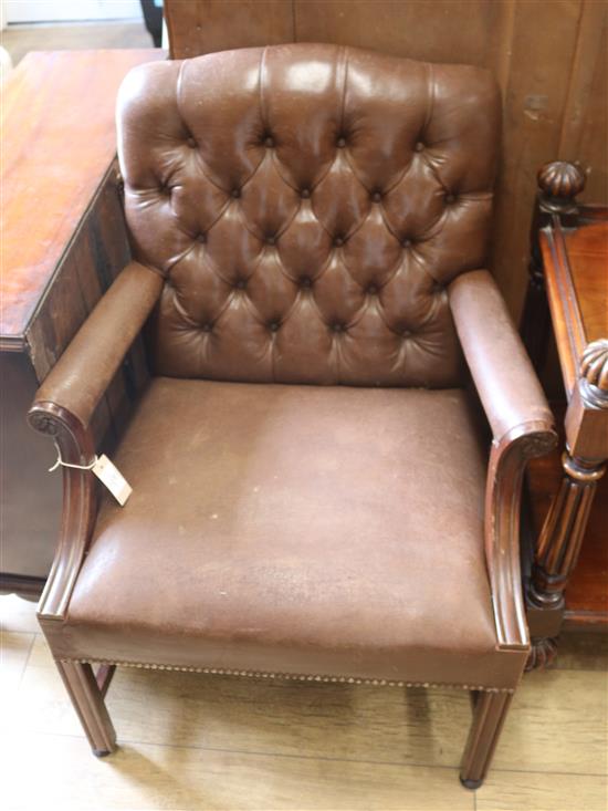 A leather button back elbow chair